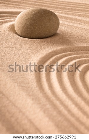 zen background with round stone and lines in the sand. Japanese zen garden for relaxation and meditation