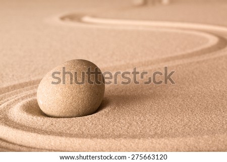 zen stone and sand in Japanese meditation garden. Spa wellness background for balance and spirituality.