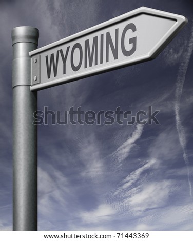 wyoming road sign arrow pointing towards one of the united states of america signpost with clipping path