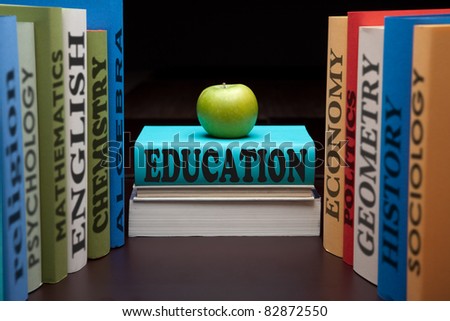 School books on a stack educational textbooks with text and apple education leads to knowledge wisdom in the study book for university or college.