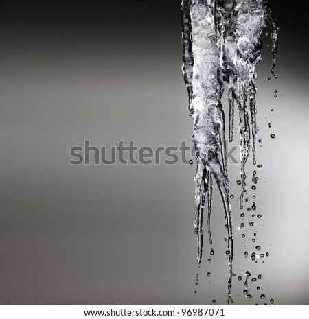 icicles sparkling white melting ice hanging down concept for global warming