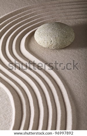 japanese zen garden sand and rocks or stones from calm linear pattern leading to spiritual balance