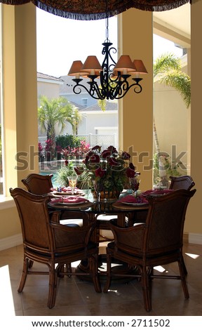 stylish casual dining table with place settings in upscale home