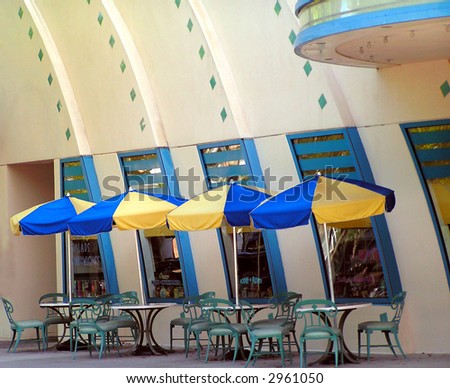 blue and yellow umbrellas at an outdoor cafe
