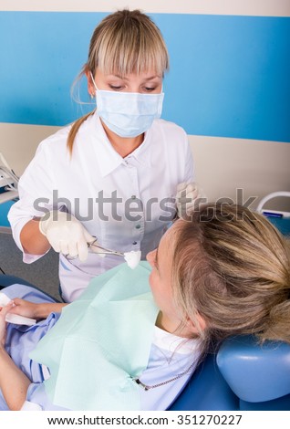 dentist examines the patient\'s mouth. the patient is ready for treatment teeth