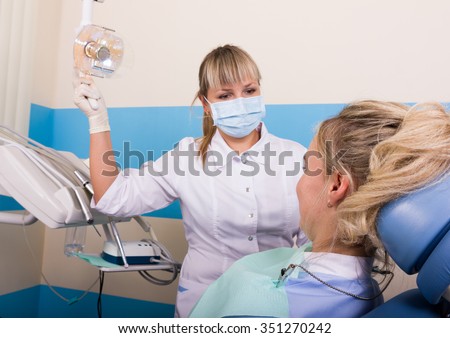 dentist examines the patient\'s mouth. the patient is ready for treatment teeth
