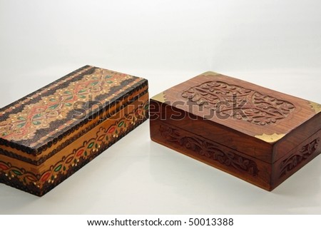 Two wooden jewel boxes on white background