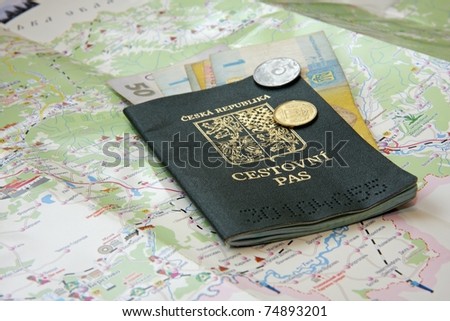 Passport and Ukrainian money on a map of Ukraine