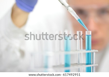 Chemical laboratory worker during biochemical analysis.