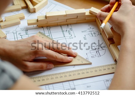 Architect working on blueprint. Architects workplace - architectural project, blueprints, ruler. Construction concept. Engineering tools.