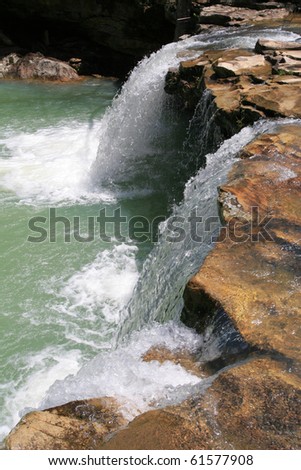 Spring runoff pours over a small falls on an Ozark stream