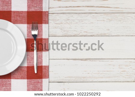 dinner plate, knife and fork setting on white table top view