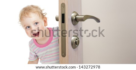 happy kid behind door