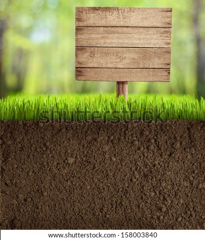 soil cut in garden with wooden sign