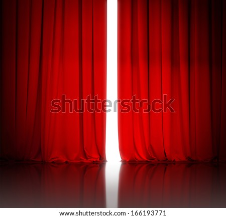 red theater or cinema curtain slightly open and white light behind it