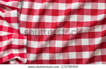 red crumpled checkered picnic tablecloth