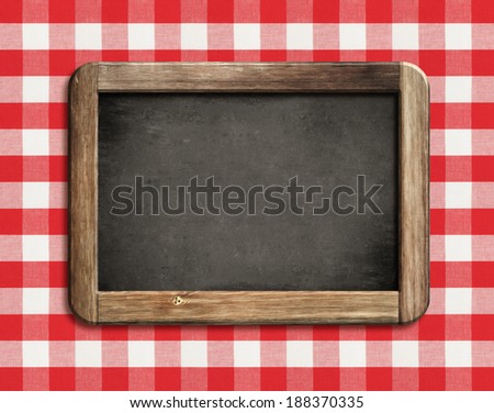 chalkboard or blackboard on picnic tablecloth