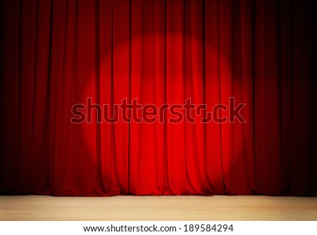 red curtain with spot light theater stage