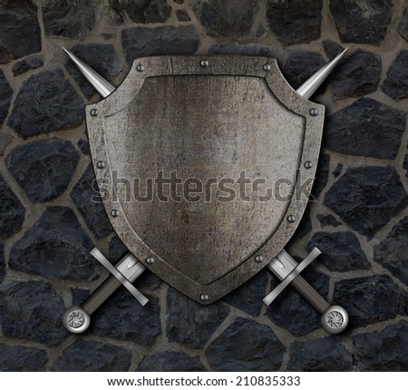 Medieval shield and crossed swords on stone wall
