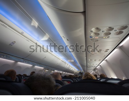 airplane or jet cabin full of passengers
