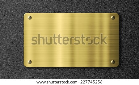 gold or brass sign metal plate over black background