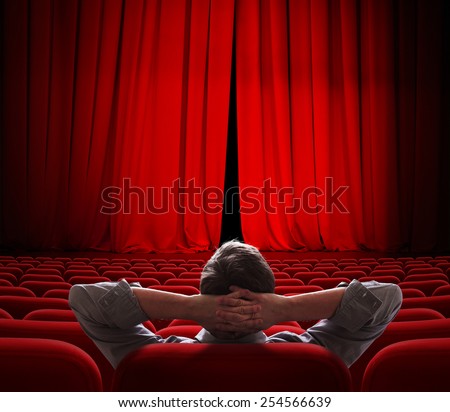 cinema screen red curtains slightly open for vip person