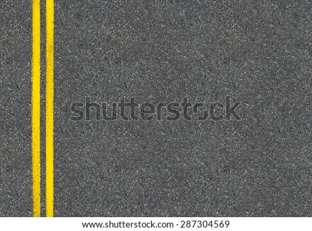 Asphalt road top view with two yellow lines