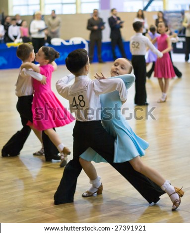 TOMSK, RUSSIA - NOV 28 : Winner of couple dancing - Arina Marukhina, 9 and Daniil Pisankin, 9 (no 48) at sport dance competition among children born in 2000 on November 28, 2008 in Tomsk, Russia.