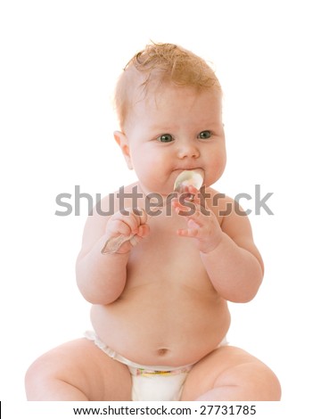 Baby-girl with silver spoon in mouth