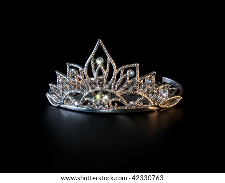 stock photo Tiara or diadem with colorful sparkles on black background