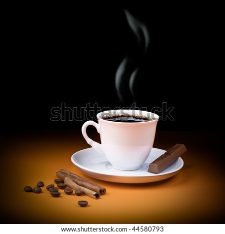 Black coffee cup with steam and piece of chocolate, beans and cinnamon