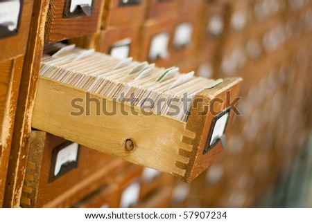 Old wooden card catalogue with one opened drawer