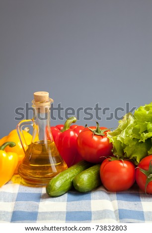healthy food fresh vegetables still life on blue checked tablecloth