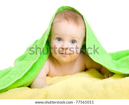 Adorable baby in colorful towel