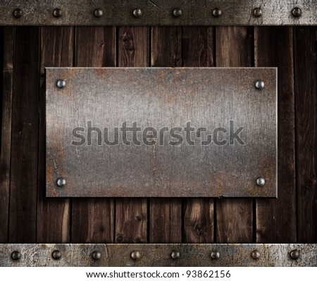 metal plate  on old wooden wall or door