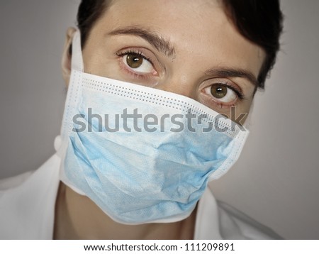 doctor face with a surgical mask