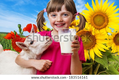 little girl drinking goat milk