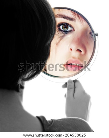 young girl looking in the mirror and crying - sensitive eyes