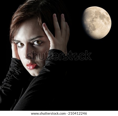 young woman portrait on dark background with moon