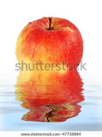 apple and mirroring effect in water