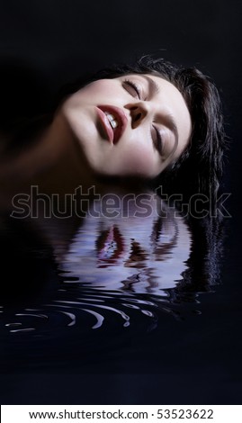 woman face and mirroring  in water