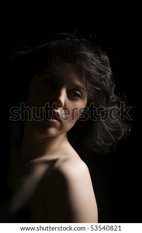 young woman profile on black background