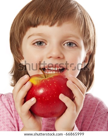 little girl four years old with red apple
