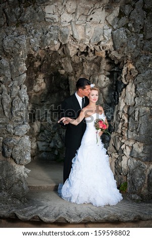 Bride and groom on ancient stairs