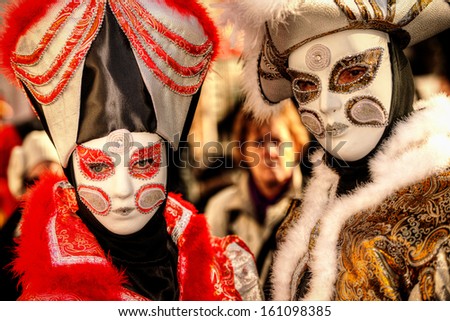 VENICE, ITALY - FEBRUARY 8: Unidentified people in Venetian masks at St. Mark\'s Square, Carnival of Venice on February 8, 2013. The annual carnival is from February 2 to February 12, 2013.