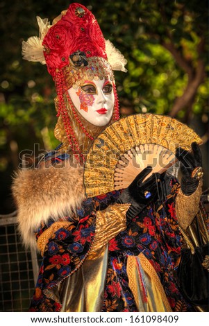 VENICE, ITALY - FEBRUARY 8: Unidentified person in Venetian masks at St. Mark\'s Square, Carnival of Venice on February 8, 2013. The annual carnival is from February 2 to February 12, 2013.