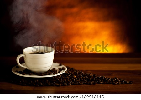 Cup of delicious black coffee on a wooden table