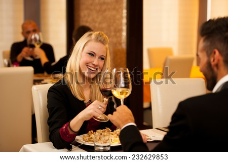 Young people eat dinner at restaurant