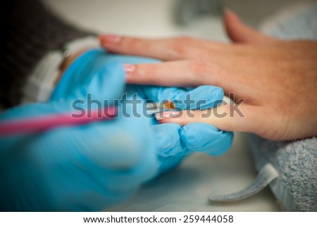 Making hand nails in a professional hand care salon
