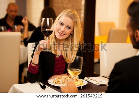 Young people eat dinner at restaurant
